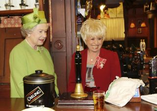 Queen Elizabeth II on the set of EastEnders with Barbara Windsor in 2001