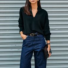 Woman in black sweater and jeans