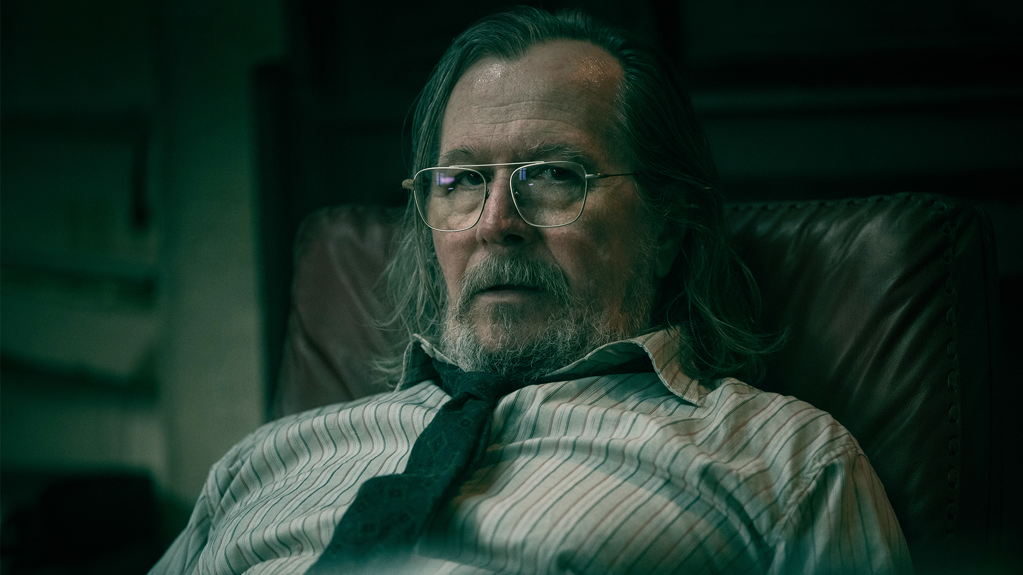 Gary Oldman as Jackson Lamb, sitting at his desk in Slow Horses Season 6