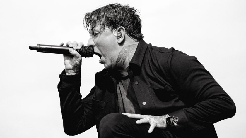 Scott Kennedy of Bleed From Within singing onstage in 2024