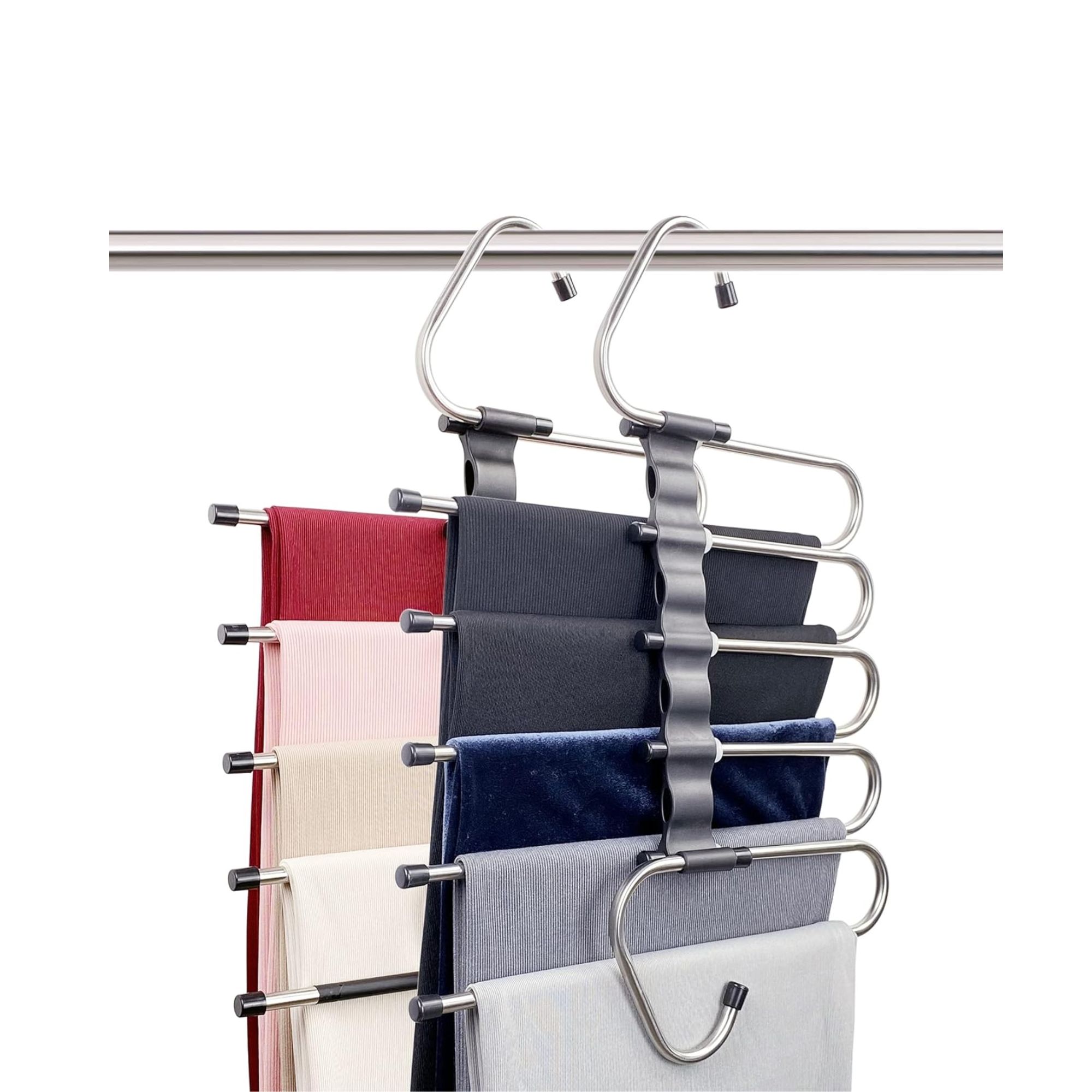 Two silver pants hangers with colorful fabric on them hanging from a silver rod