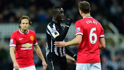 Manchester United player Jonny Evans amd Papiss Cisse of Newcastle United 