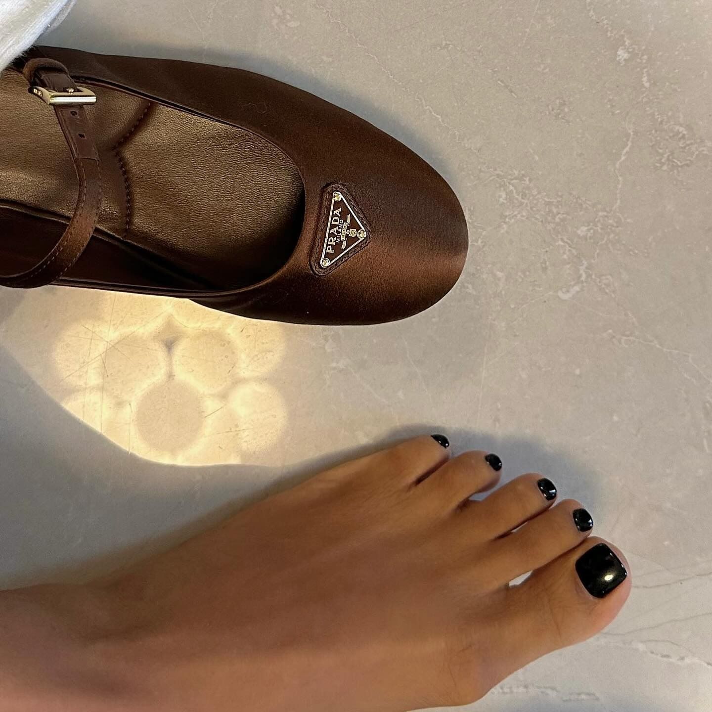 Glossy black pedicure