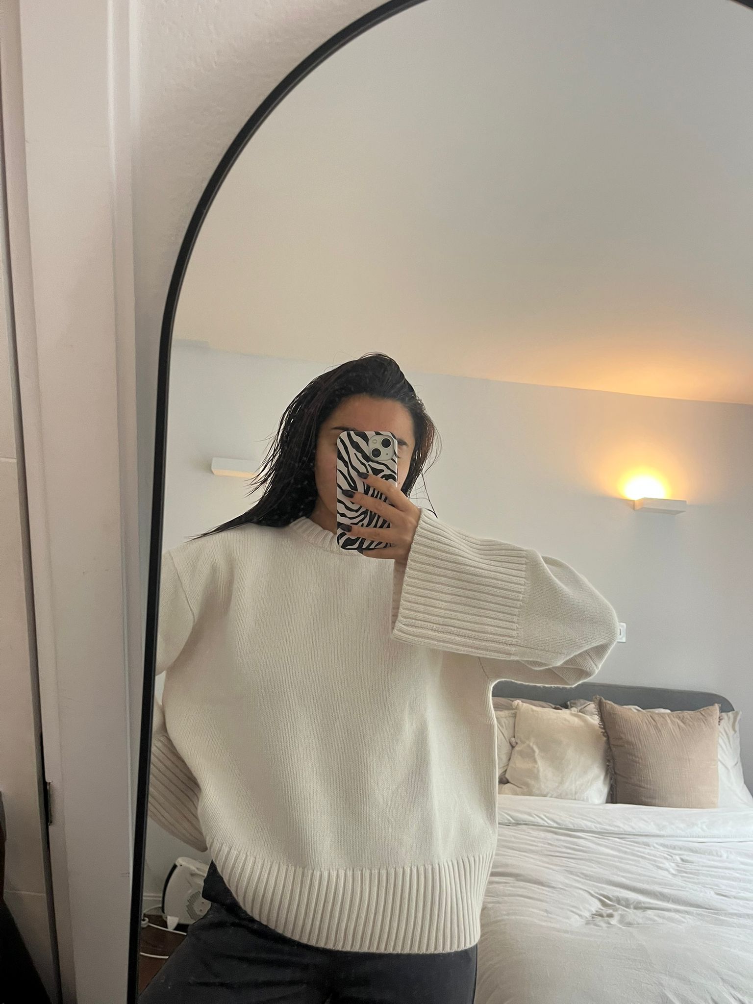 Marina wearing white jumper