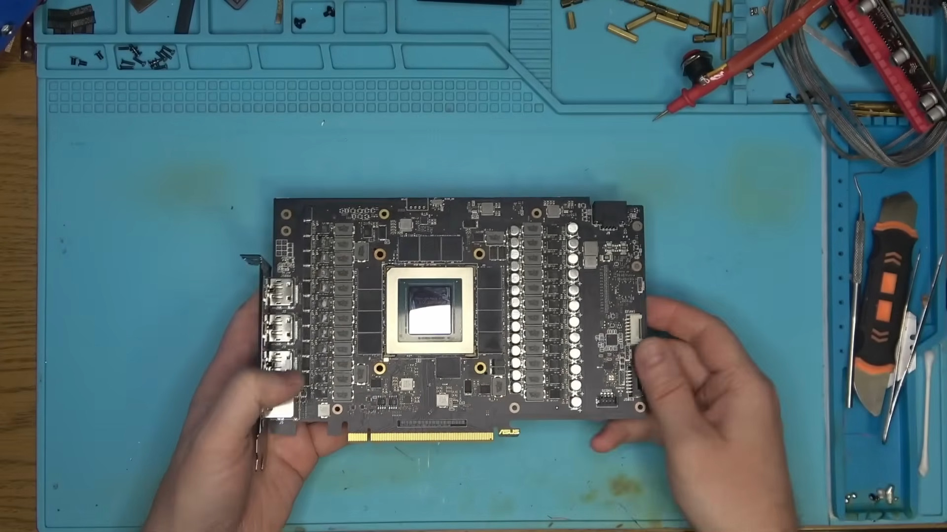 A fake RTX 4090 made by a scammer, showing the PCB, graphics chip and memory