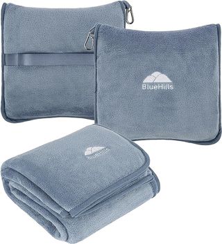 A blue-gray BlueHills travel blanket with carrying case