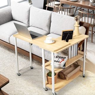 Desk on wheels in front of sofa