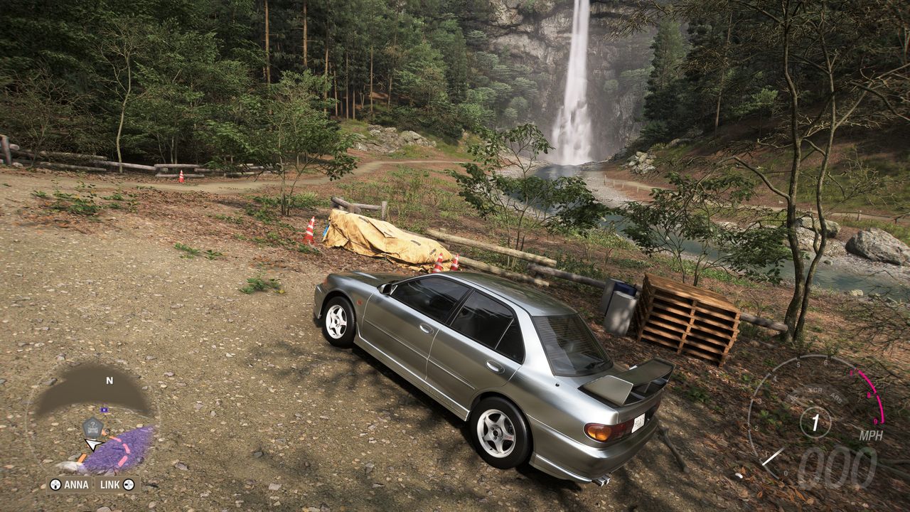 Forza Horizon 6 Treasure Cars: A Mitsubishi Lancer Evolution parked close to a waterfall.