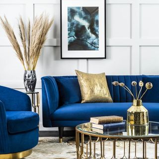 living room with blue sofaset