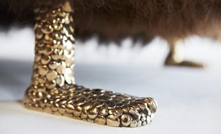 Detail view of its cast bronze Chester Cheetah feet