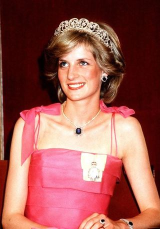 prince and princess of wales tour of australia and new zealand in the spring of 1983, princess diana attends a state reception at the crest hotel in brisbane, she is wearing a pink dress and tiara and sapphire engagement ring, 11th april 1983 photo by gavin kentmirrorpixgetty images