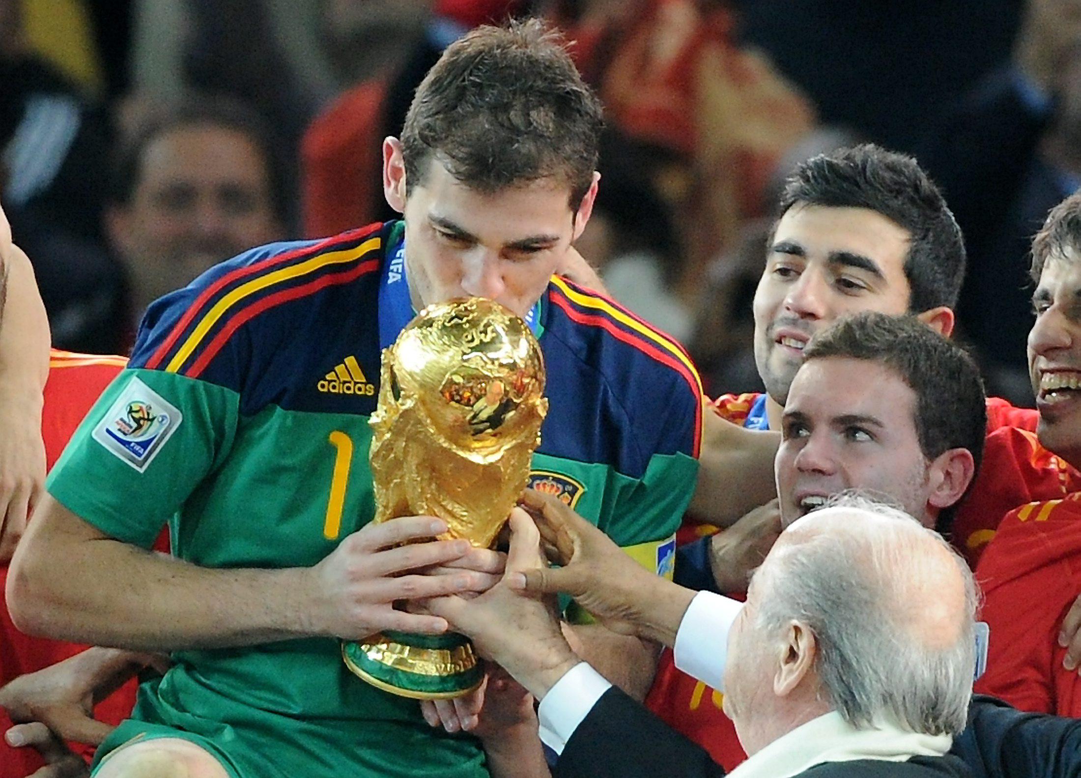 Iker Casillas kisses the World Cup trophy after Spain's win in 2010.