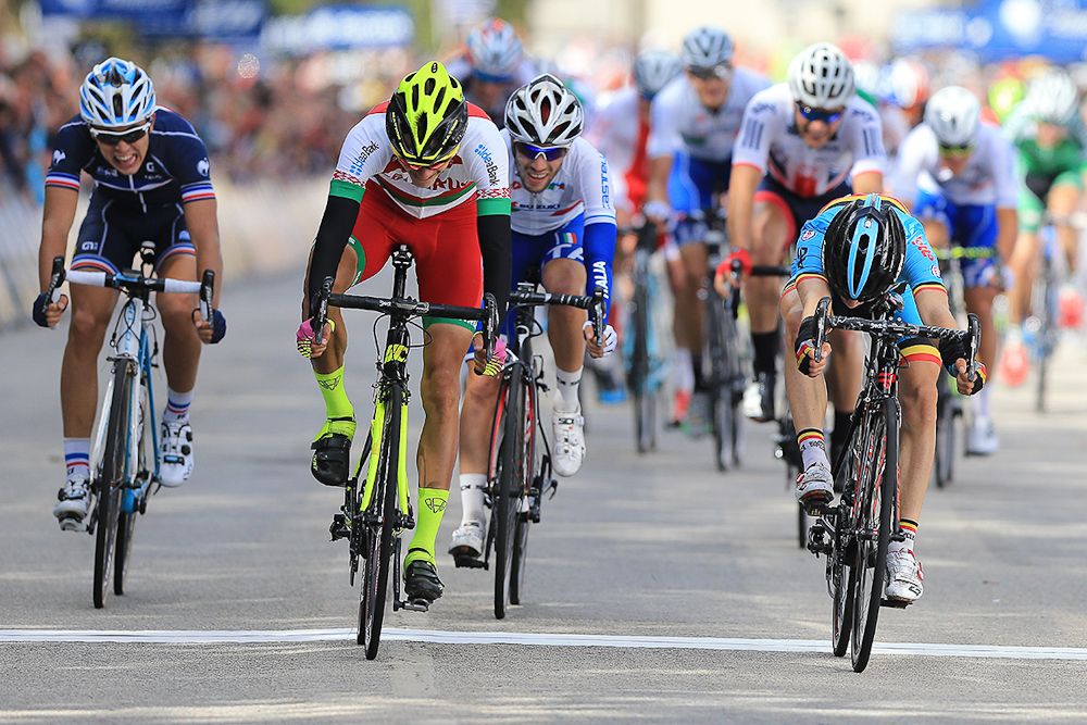 Riders throw their bikes for the line in the U23 road race