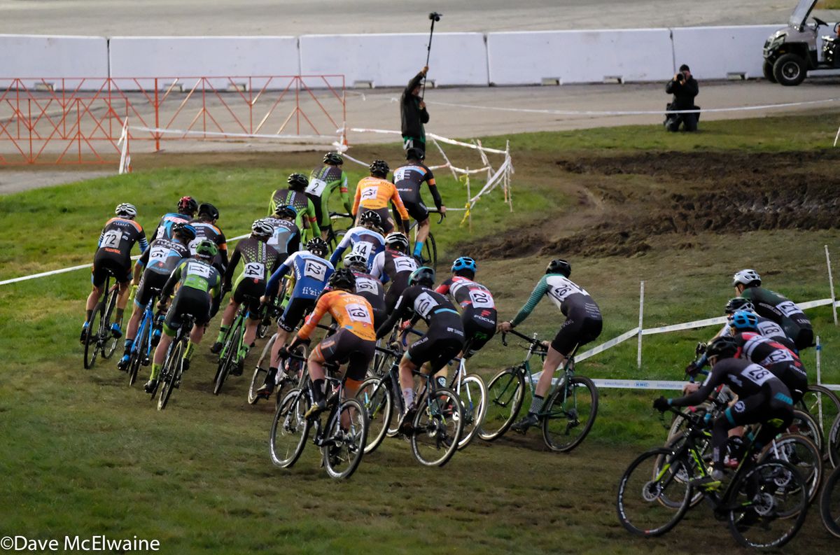 The Elite Men approaching the track crossing during the first lap