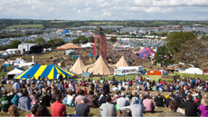 Glastonbury festival fields and tents.