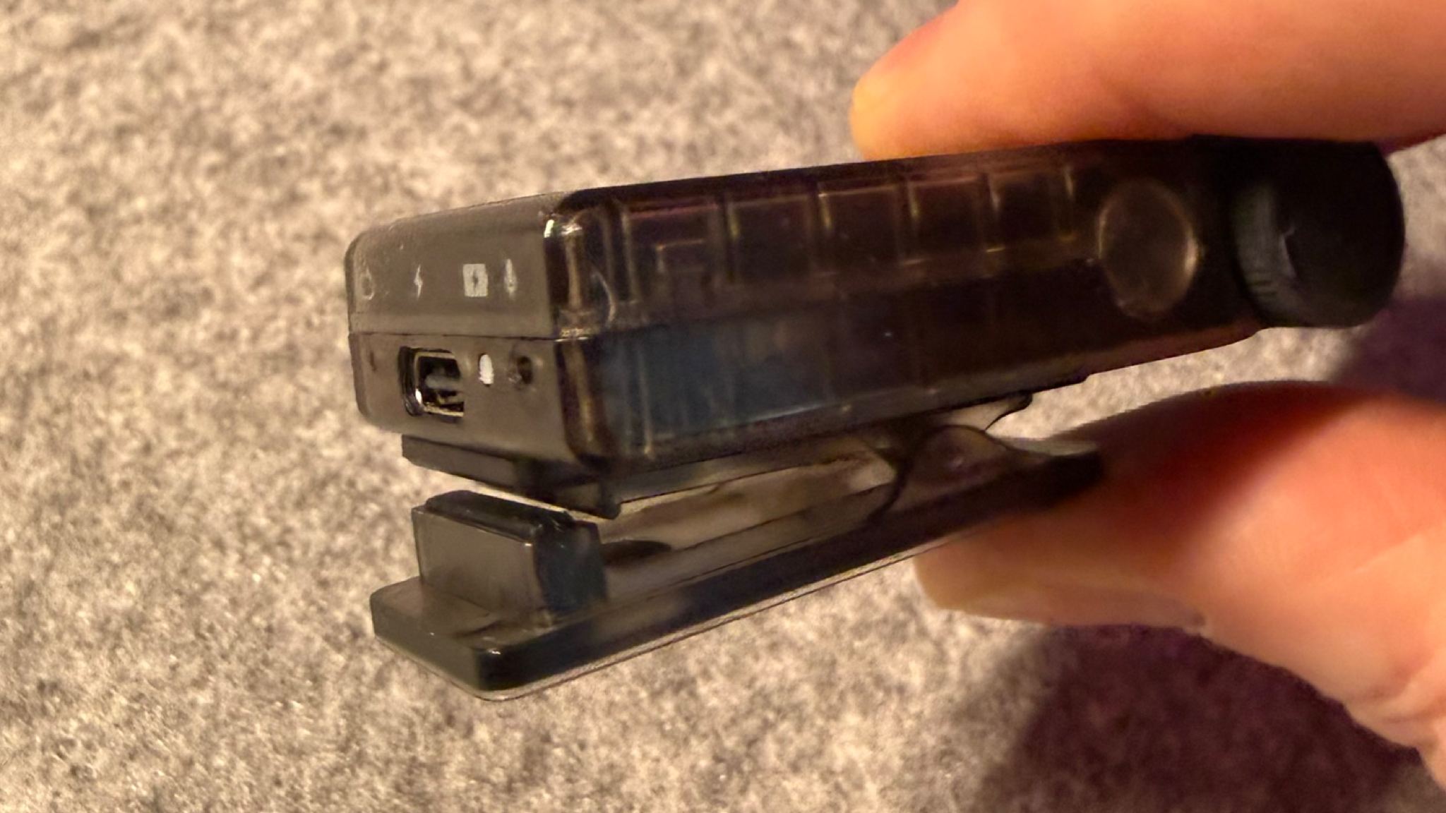 Close up of the iFi GO Blu Air with its optional magnetic clip attached