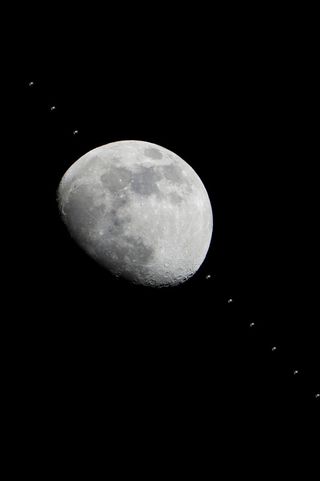 Multiple images of the International Space Station flying over the Houston area have been combined into one composite image to show the progress of the station as it crossed the face of the moon in the early evening of Jan. 4, 2012.