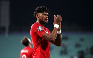 Tyrone Mings applauds England's fans at full-time