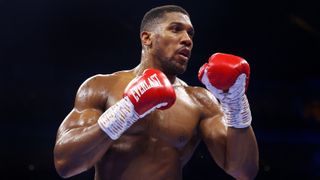 Anthony Joshua looks on during the Heavyweight fight between Anthony Joshua and Jermaine Franklin at The O2 Arena on April 01, 2023 in London, England. 