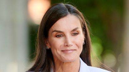 Queen Letizia of Spain’s chic pantsuit. Seen here she attends a Mental Health Congress