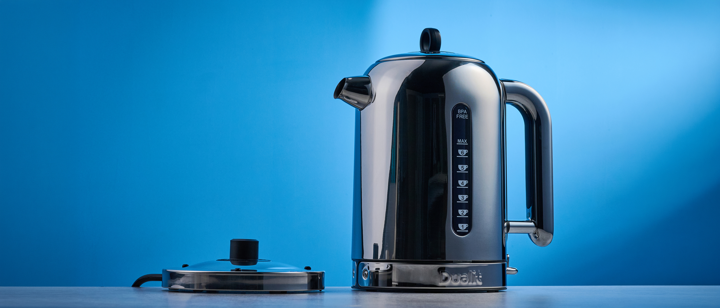 Dualit Classic Kettle photographed in front of a blue background