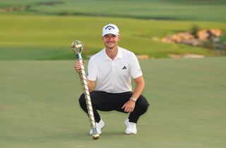 Nicolai Hojgaard holds the DP World Tour Championship trophy