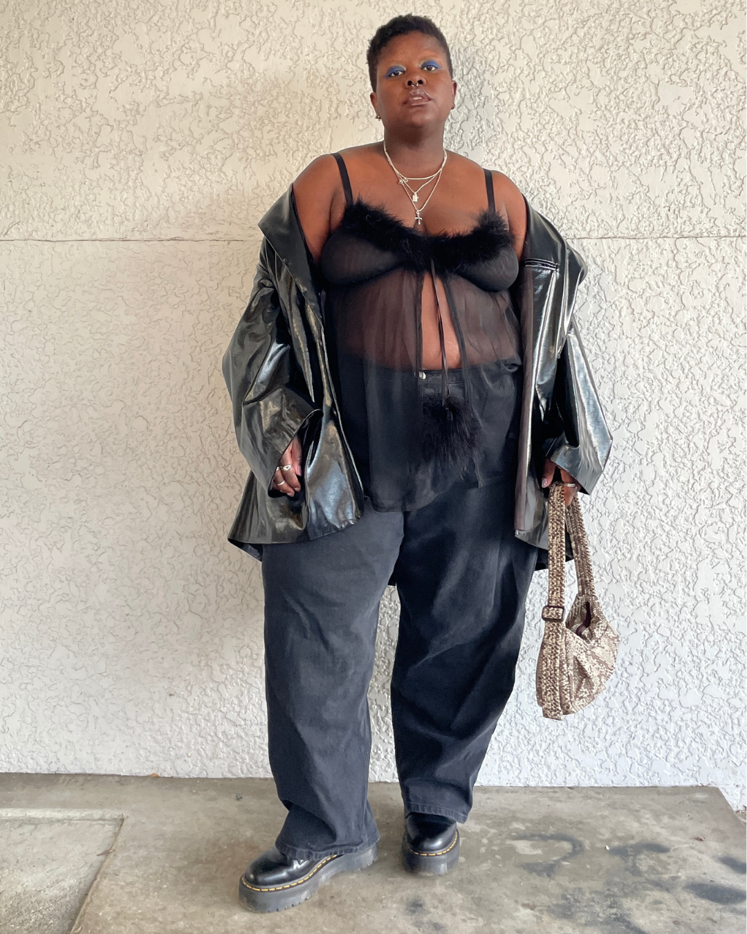 Lydia Okello wearing an all-black outfit