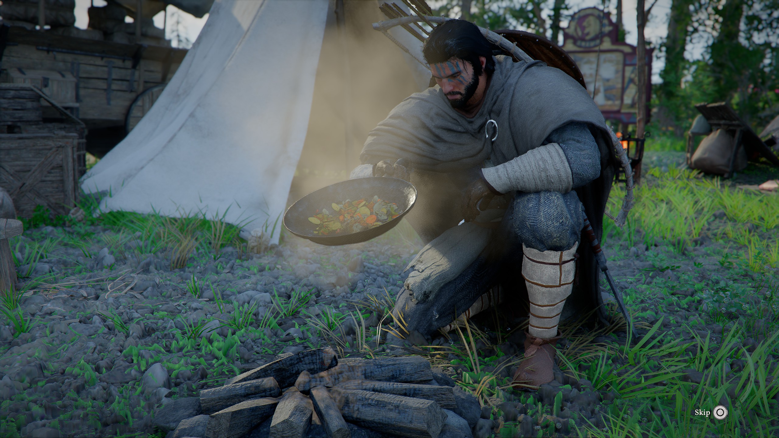 Kliff cooks a pan of vegetables over a bonfire, while a tent is in the background.