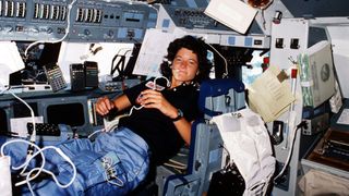 sally ride serving as mission specialist 2, appears to float in weightlessness aboard Space Shuttle Challenger. 