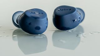 Jabra Elite 8 Active earbuds loose and wet.