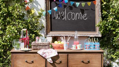 garden drinks table with chalk board sign