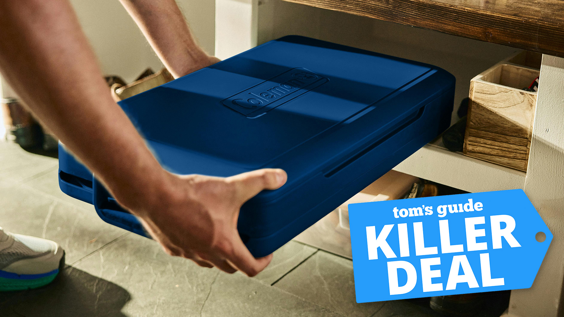 Person tucking the Coleman Snap N Go Collapsible Cooler away for storage