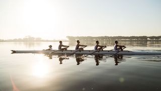 A group of elite rowers exercising in the morning