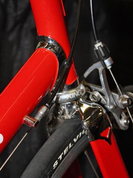 A chromed lugset and fork crown nicely offset the bright red paint.