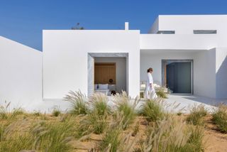 clean white exterior of modern Paros House