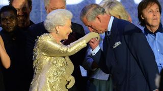 Prince Charles kisses the hand of Queen Elizabeth II