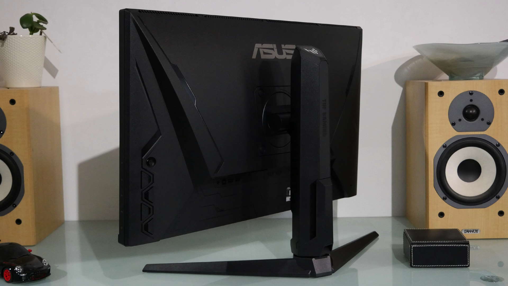 Asus TUF VG28UQL1A gaming monitor facing away from the camera so your can see the back