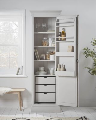 slim larder cupboard in white kitchen