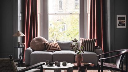 Neutral living room with warm colored curtains