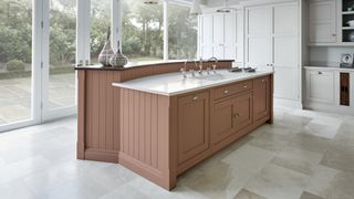 pale gray kitchen with dusky pink painted kitchen island