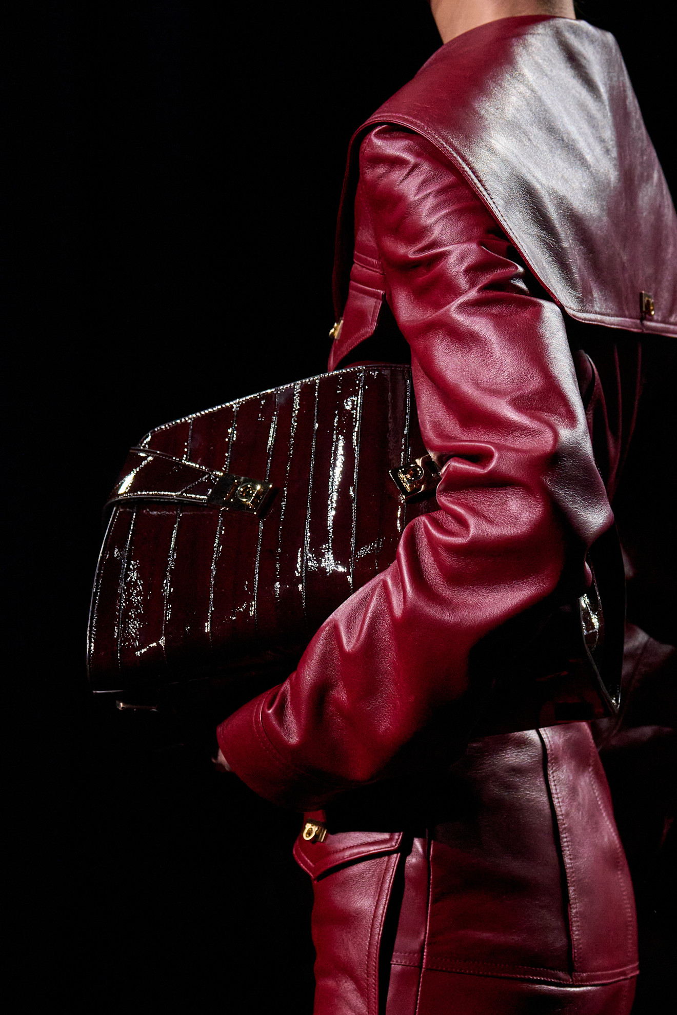 an image of a women holding the ferragamo hug bag.