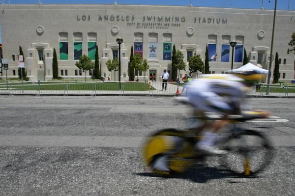 A HTC-Columbia rider rolls past the LA's swimming stadium.