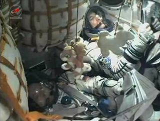 Two Expedition 36 Crew Members in Soyuz Capsule