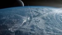 a streak of light flies into a deep crack on the surface of an icy planet