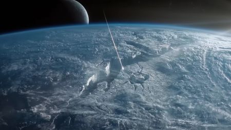 a streak of light flies into a deep crack on the surface of an icy planet