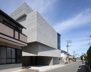 Angular house refreshes Japanese commuter town