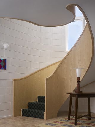 red house interior with sweeping staircase