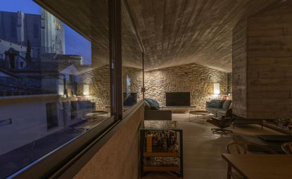 Girona house showing relationship between interior and exterior at dusk