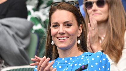 Kate Middleton blows kiss to her parents - Catherine, Duchess of Cambridge at All England Lawn Tennis and Croquet Club on July 05, 2022 in London, England. 