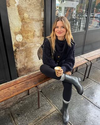 Fashion influencer @sabinasocol in Paris wearing a chic winter outfit with on-trend accessories.